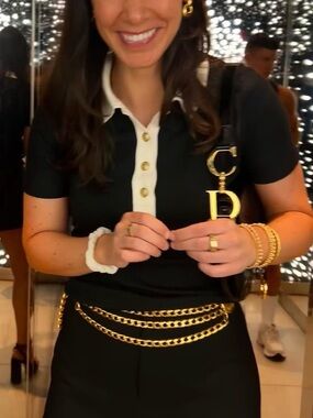 J Crew black polo shirt with gold buttons